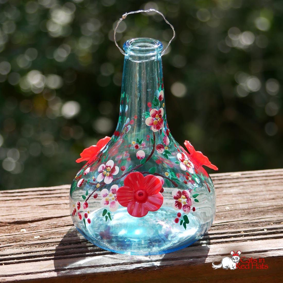 Hummingbird Feeder with red flowers
